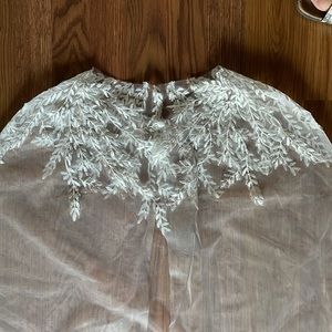 Wedding Cape with white embroidered leaf details on the shoulder